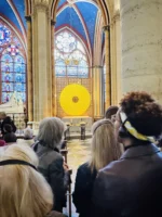 People looking at display during Notre-Dame inside tour