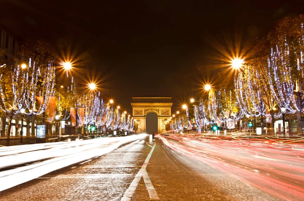 Champs Elysees with trees decorated in holiday lights in Paris