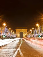 Champs Elysees with trees decorated in holiday lights in Paris