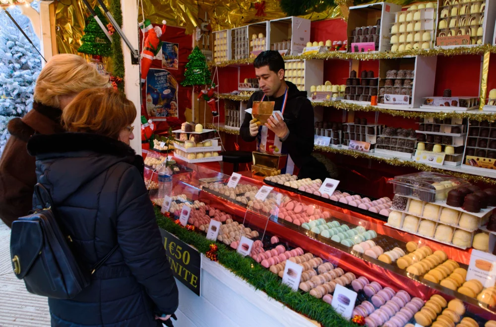 Food and sweet stalls in Christmas market in Tuileries Gardens, Paris, France