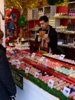 Food and sweet stalls in Christmas market in Tuileries Gardens, Paris, France