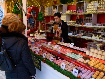 Food and sweet stalls in Christmas market in Tuileries Gardens, Paris, France