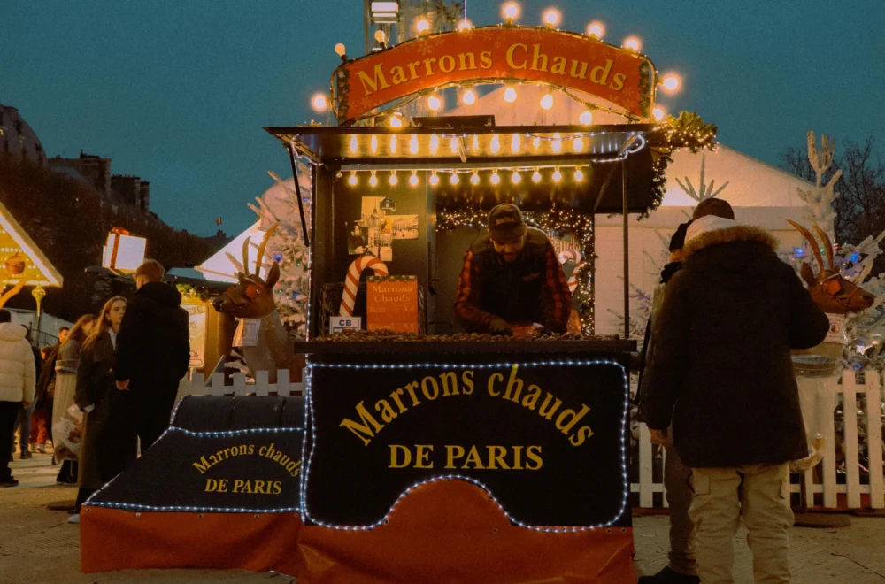 Marrons chauds chalet at holiday market on Paris Christmas tour