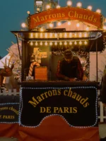 Marrons chauds chalet at holiday market on Paris Christmas tour