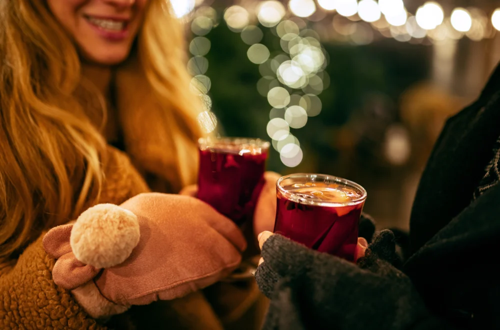 Close up of mittens and drinks during Paris Christmas Lights private guided tour