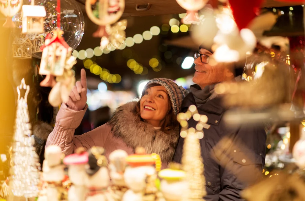 Couple looking at Christmas bauble during private guided tour in Paris France