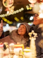 Couple looking at Christmas bauble during private guided tour in Paris France