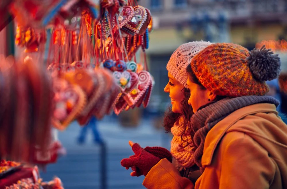 Guests looking at Christmas Market stall during private Paris guided tour