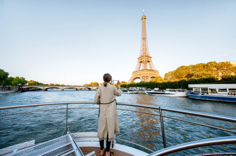 Woman admiring the Eiffel Tower from River Seine Cruise during Private Paris guided tour