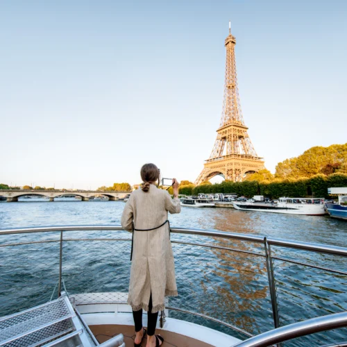 Woman admiring the Eiffel Tower from River Seine Cruise during Private Paris guided tour