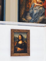 Mona Lisa at the Louvre with paintings in the background