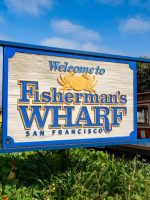 Fisherman's Wharf sign with cable car