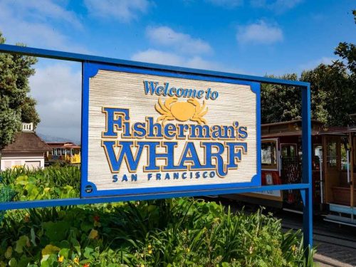 Fisherman's Wharf sign with cable car