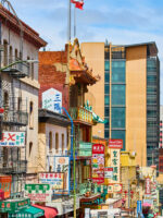 Chinatown street view of shop signs leading down street toward San Francisco Bay