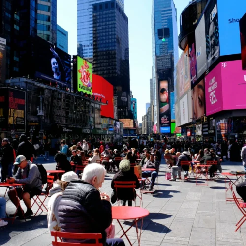 People-seated-on-a-sunny-day-in-Times-Square-NYC-scaled-1-2048×1366