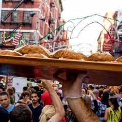 man holding a plate with pastry