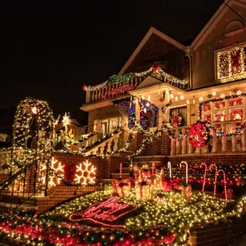 Decorated house in Dyker Heights with holiday lights during Christmas Lights tour