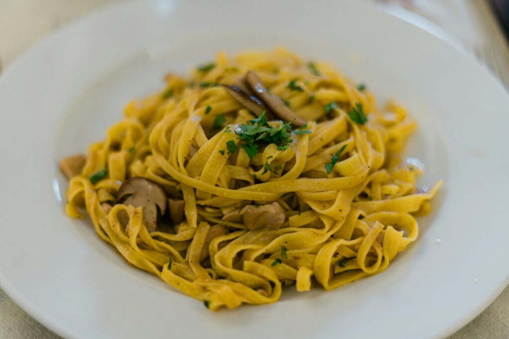 Close up of pasta dish on white plate