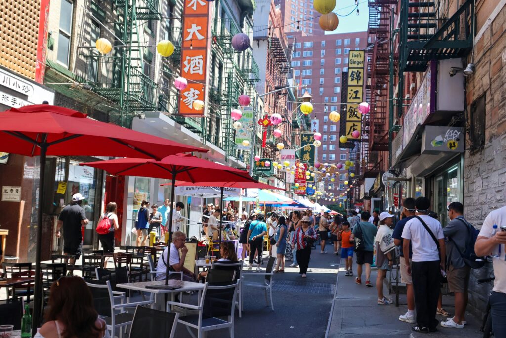 Group of people walking down Chinatown in New York