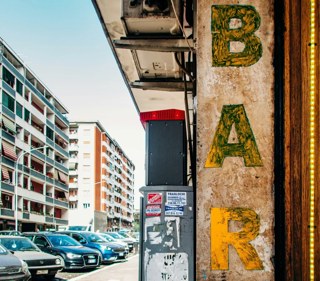 A painted sign outside a local bar in Rome Italy