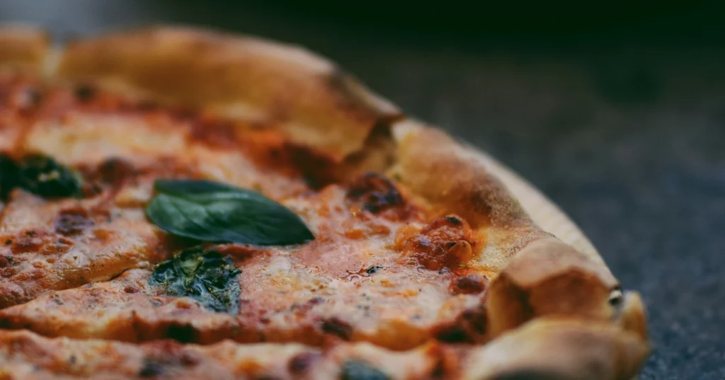 Close up of pizzas on table