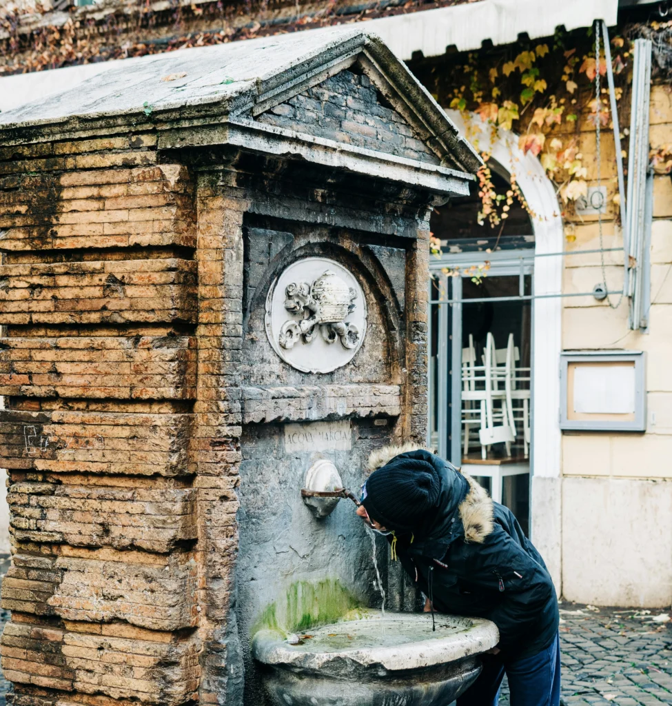 Drinking fountain dated 1870 in Borgo Pio Italy