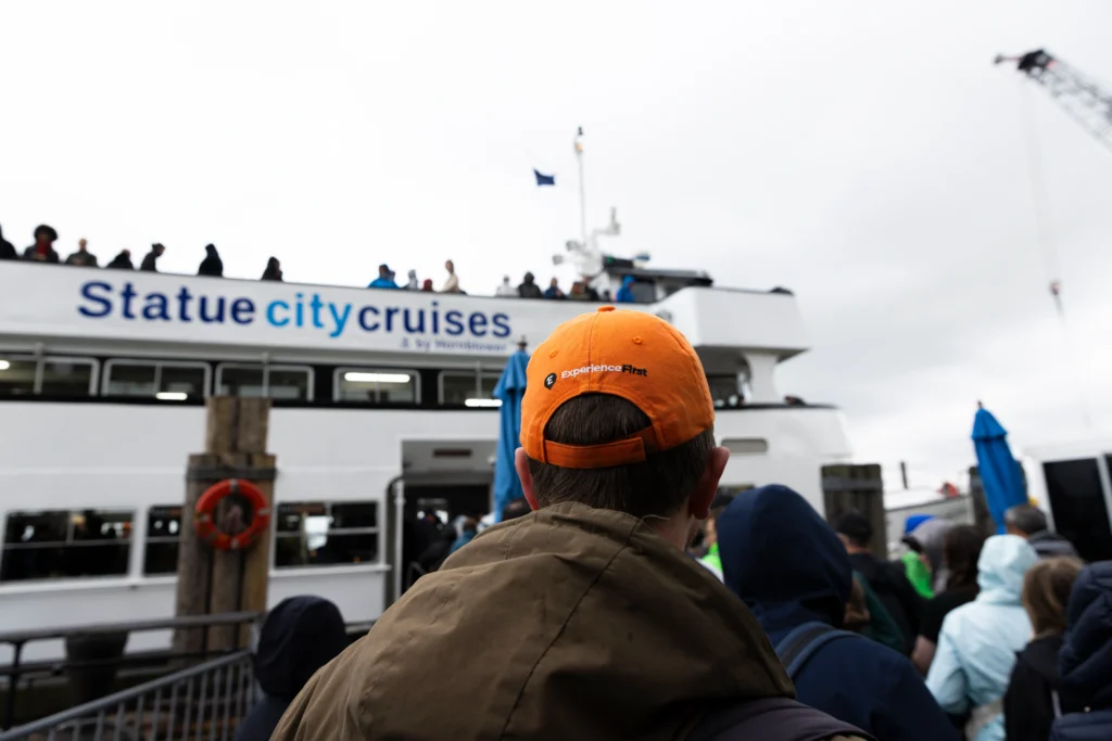 Guide next to cruise on Statue of Liberty and Ellis Island Guided Tour