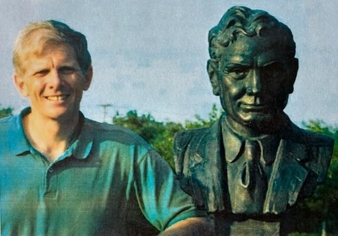 Robert Billingsley next to a bust of his father, Logan, who founded the National Hall of Fame for Famous American Indians