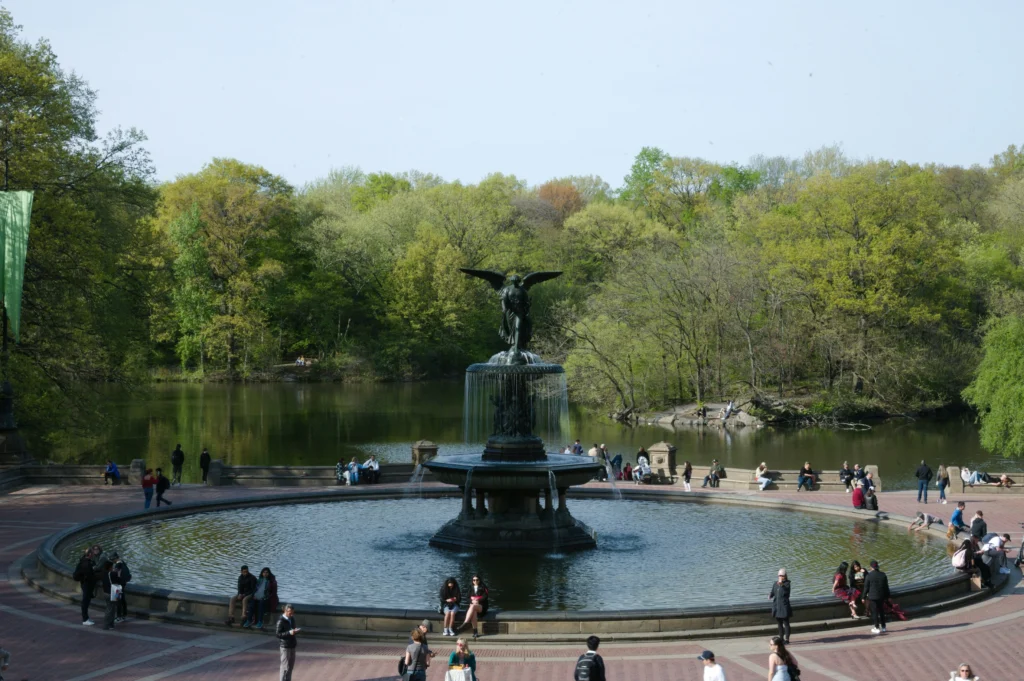 A group of people standing Bethesda Terrace