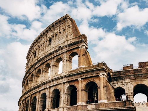 Colosseum under white clouds