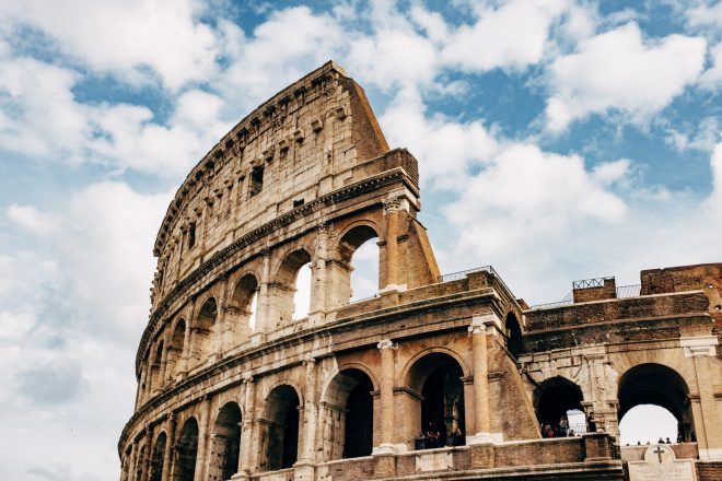 Colosseum under white clouds